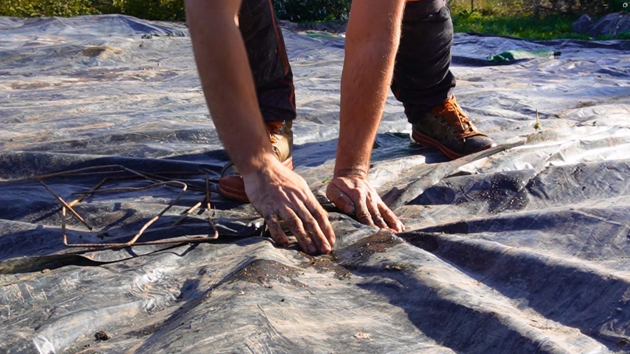Preparing a bed before laying the winter tarp